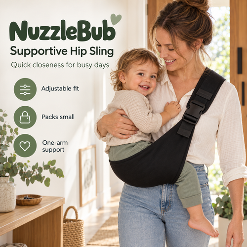 Parent supporting a toddler in the black NuzzleBub Supportive Hip Sling